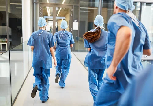 team of emergency doctor Bali walking through hospital corridor to respond to urgent case